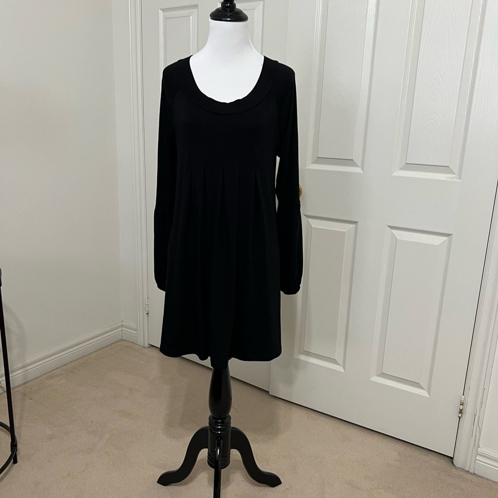 Black knit scoop neck dress with pleated front